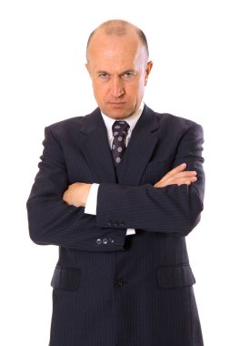 Serious businessman looking at camera clipart