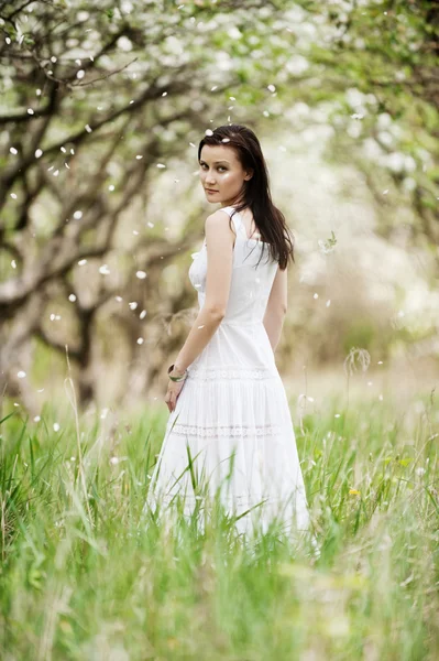 Beautiful young woman in white dress — Stock Photo, Image