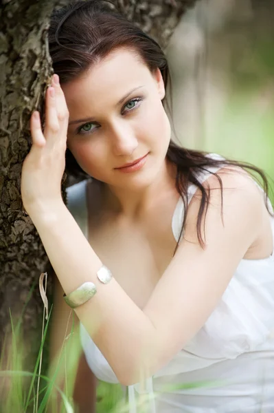Portrait of pretty woman in white dress — Stock Photo, Image