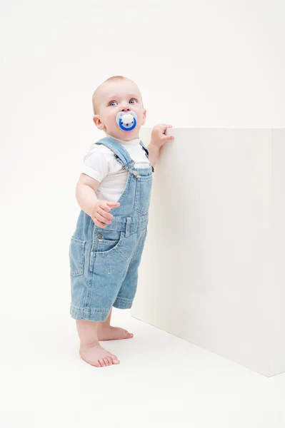 Little boy in jean dungarees — Stock Photo, Image
