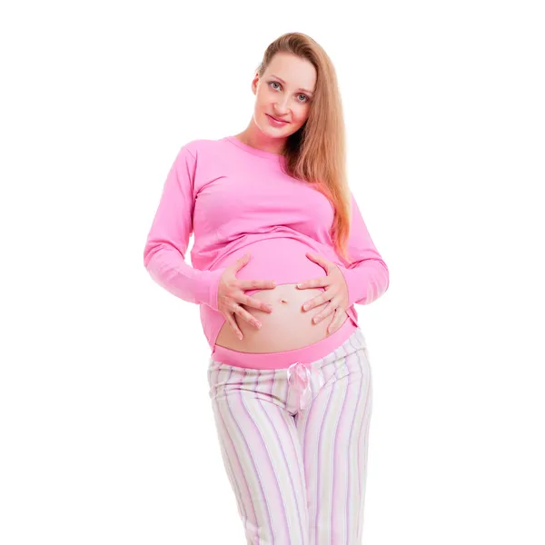 Vackra gravid kvinna i rosa pyjamas — Stockfoto