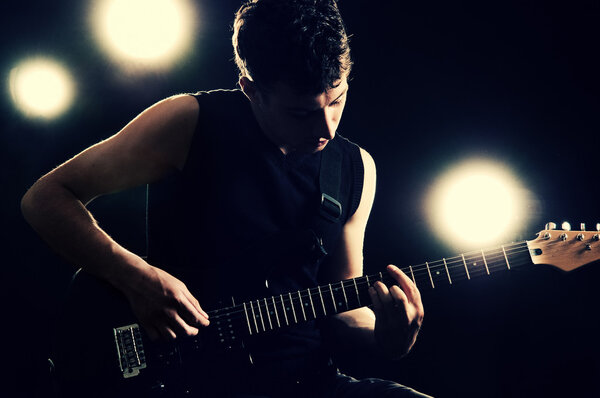 Guitarist playing on the stage