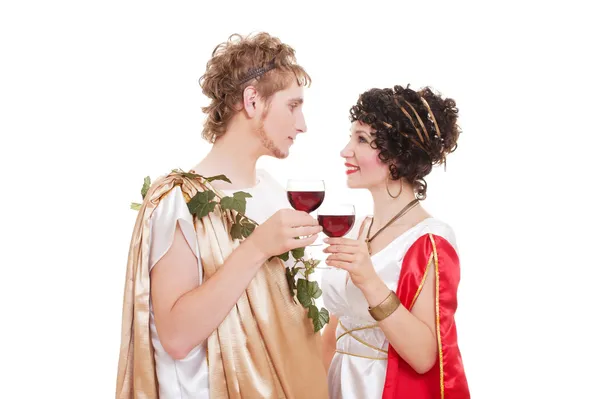 Couple in greek style with wine — Stock Photo, Image