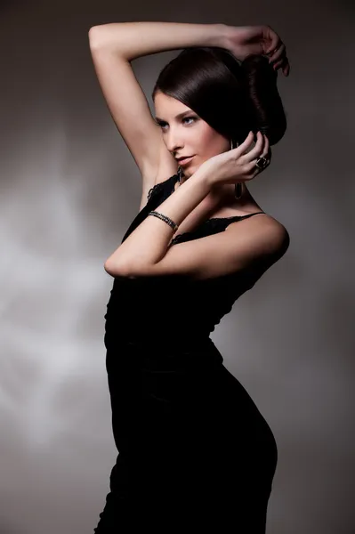 Woman in black dress posing — Stock Photo, Image