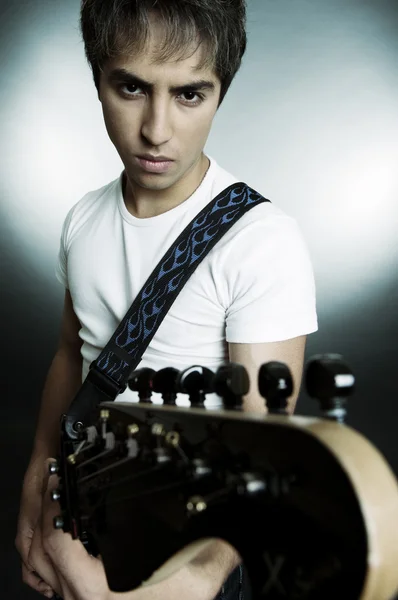 Portrait of young man with guitar — Stock Photo, Image