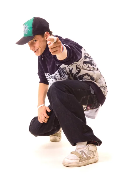 Смайлик хіп-хоп Танцююча в Кап, вказуючи на камеру — стокове фото