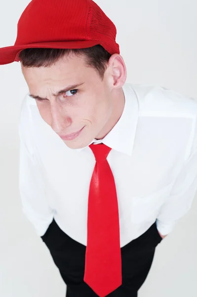 Young man in red cap and necktie — Stock Photo, Image