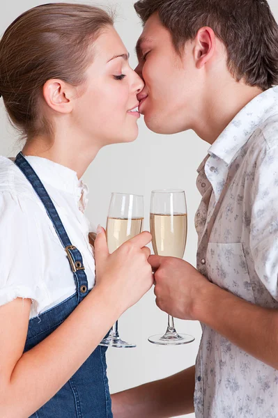 Kissing couple with glasses — Stock Photo, Image