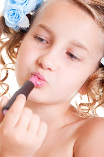 Small beauty painting her lips — Stock Photo, Image