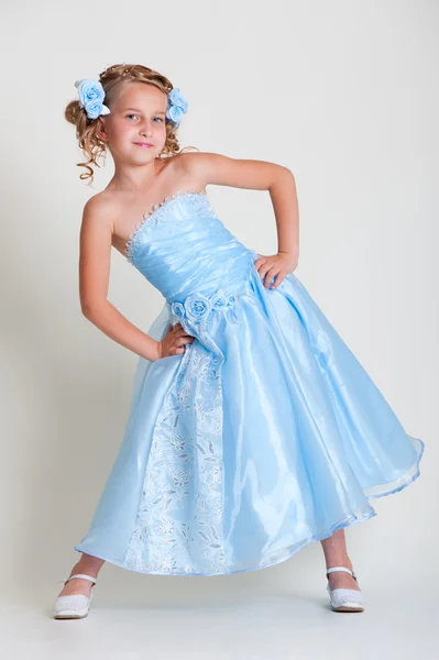 Small pretty model in blue dress — Stock Photo, Image