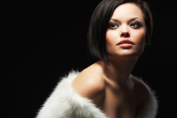 stock image Beautiful woman in white fur