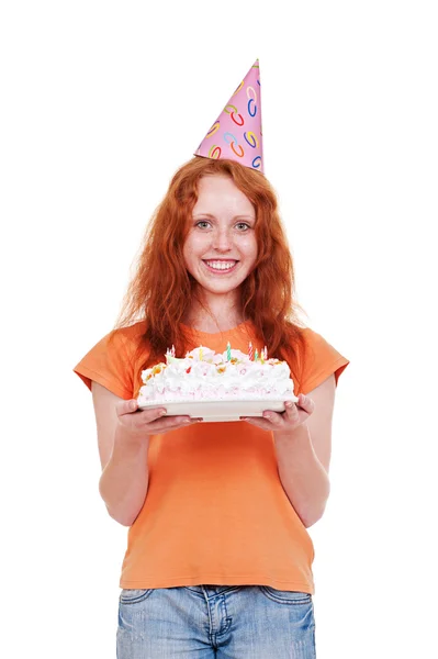 Sorridente menina no engraçado cap segurando bolo — Fotografia de Stock