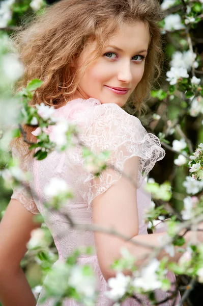 Model posing in white flowers — Stock Photo, Image