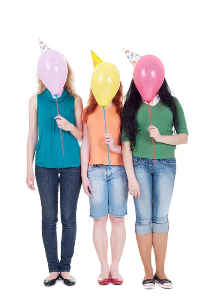 Три дівчини з повітряними кулями — стокове фото