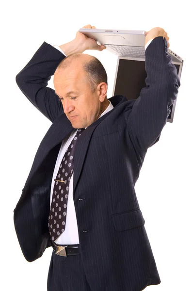 Бизнесмен пытается сломать свой ноутбук — стоковое фото