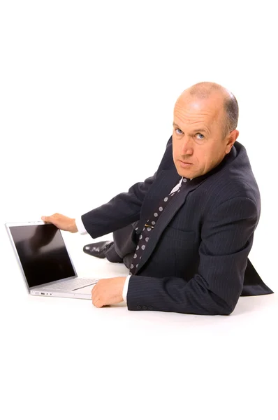 Homem de negócios com laptop no chão — Fotografia de Stock