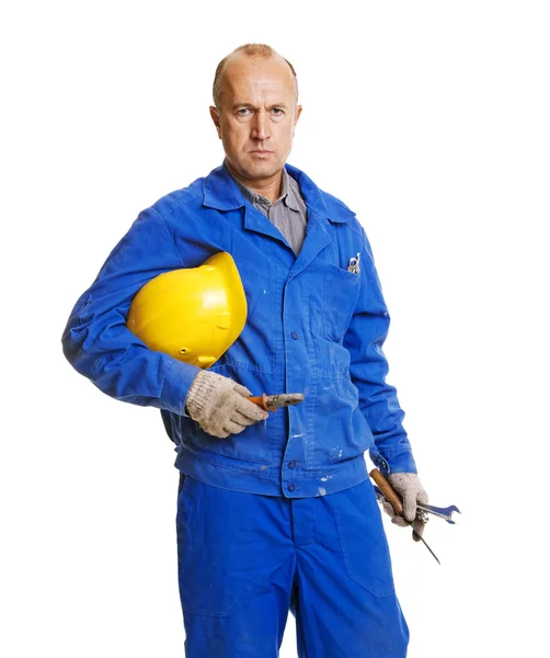 Serious worker holding his hardhat and different tools — Stock Photo, Image