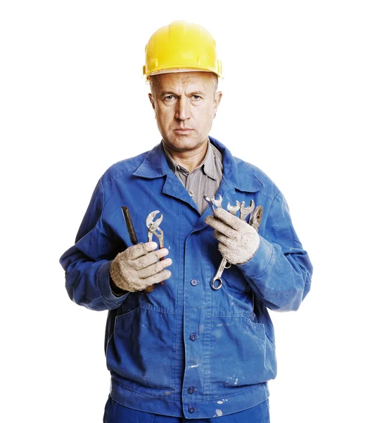 Serious worker with different tools — Stock Photo, Image