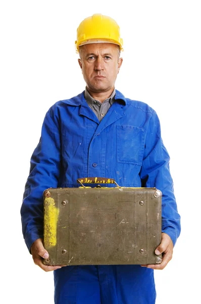 Serious worker with old suitcase — Stock Photo, Image