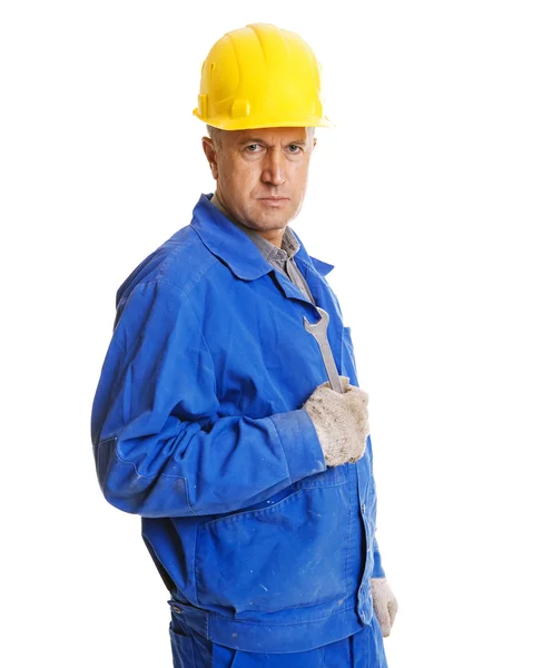 Serious worker with screw key — Stock Photo, Image