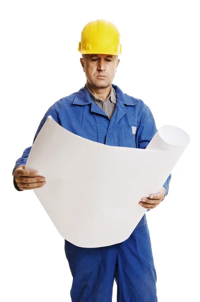 Serious workman looking to blueprints — Stock Photo, Image