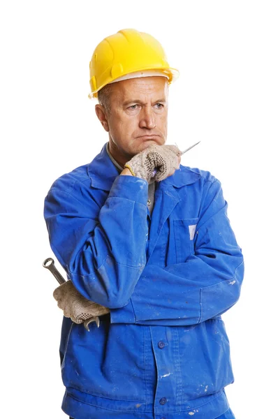 Thoughtful workman with tools — Stock Photo, Image