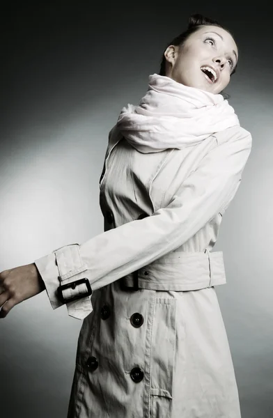 Beautiful model in grey cloak — Stock Photo, Image