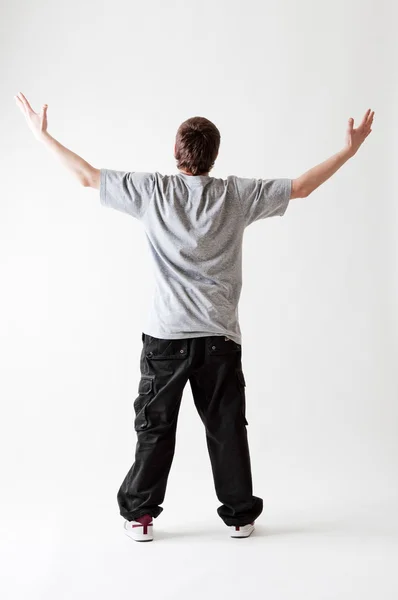 Back view of teenager in grey T-shirt — Stock Photo, Image