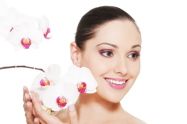 Beautiful woman with orchid — Stock Photo, Image