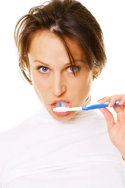 stock image Attractive girl cleaning her teeth