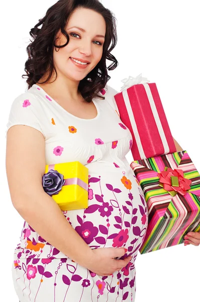 Donna incinta con scatole regalo Fotografia Stock
