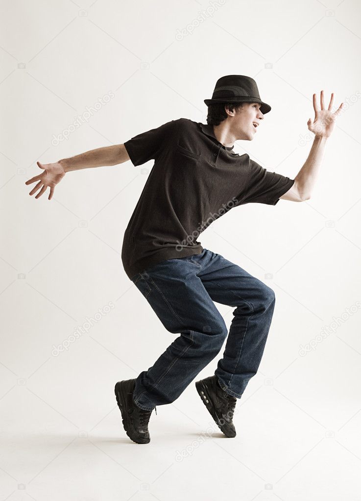 Stylish man in hat dancing