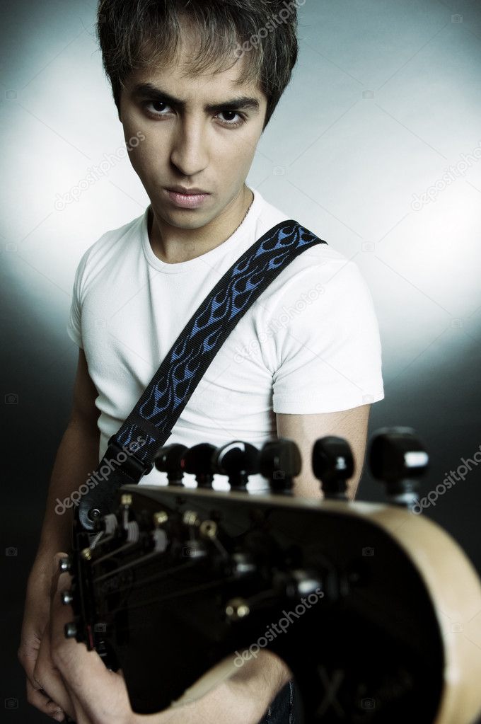 Portrait of young man with guitar