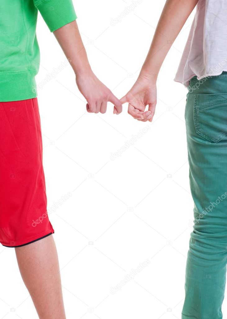 Teenagers holding hands against white background