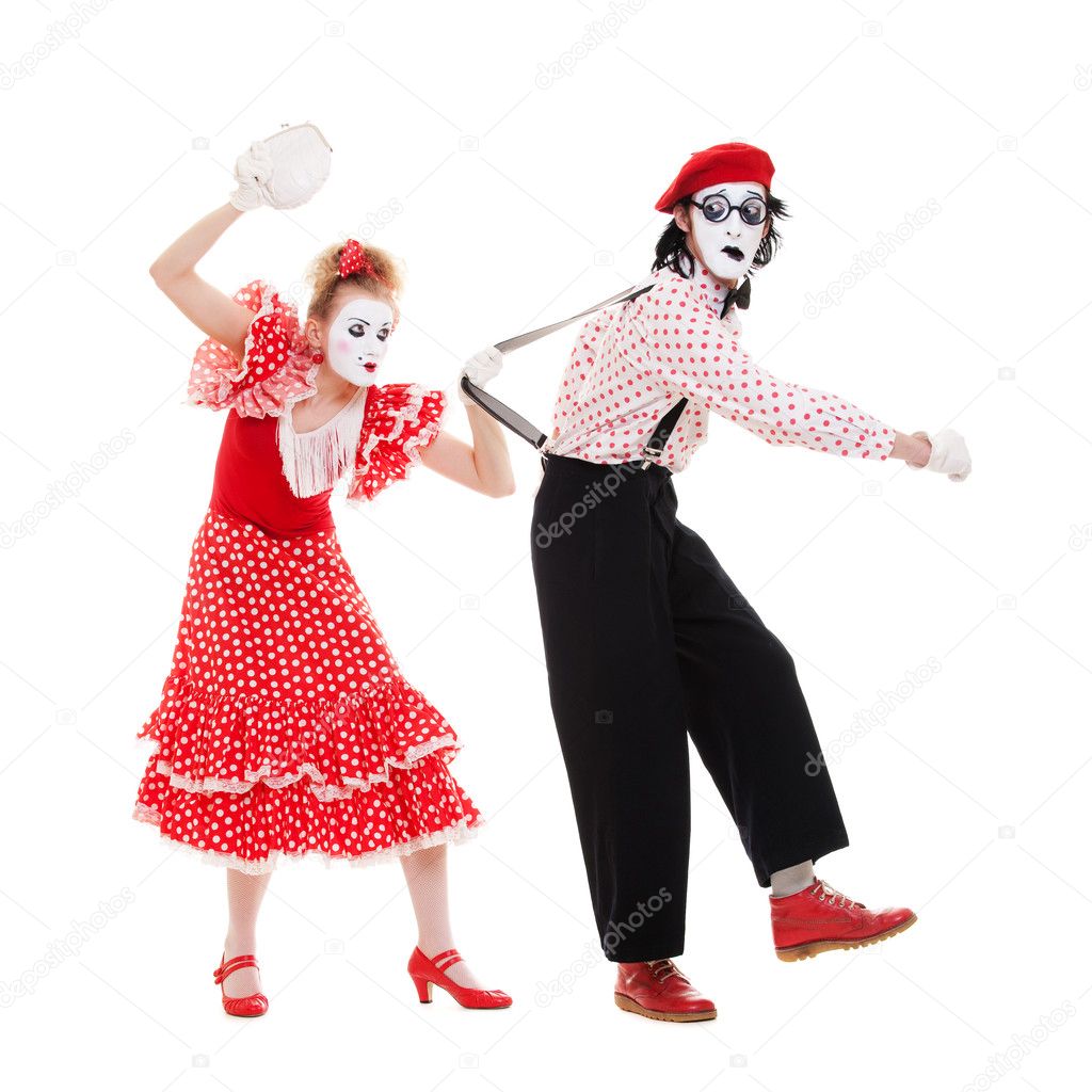 Portrait of mimes. angry woman beating man