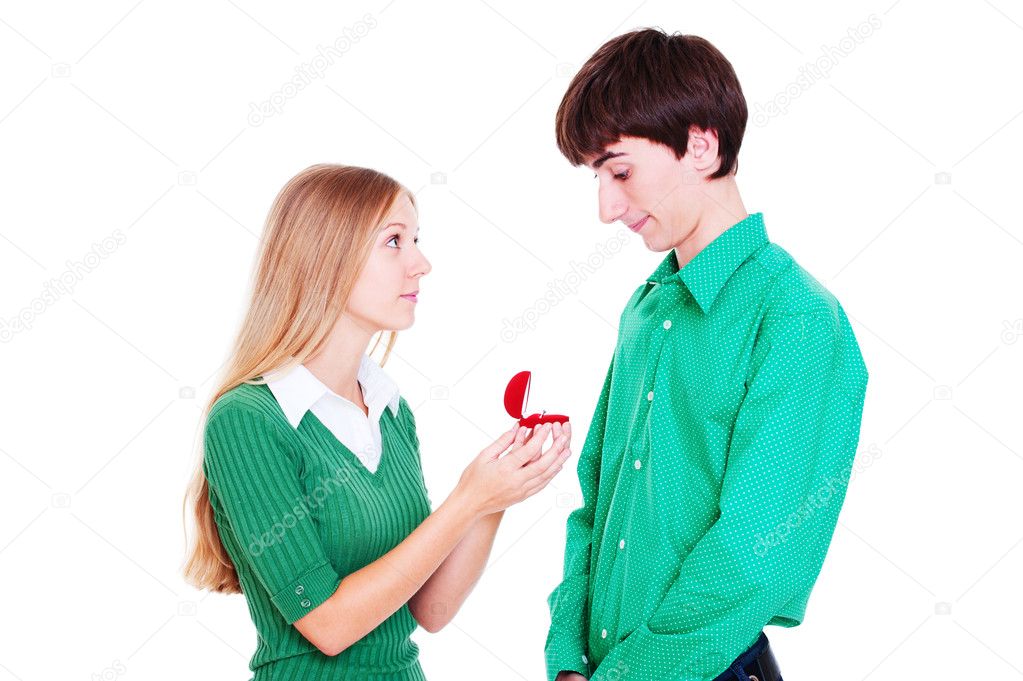 Smiley woman giving ring to man