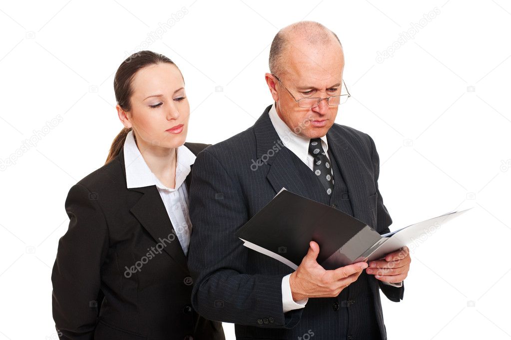 Businesswoman furtively looking at documents