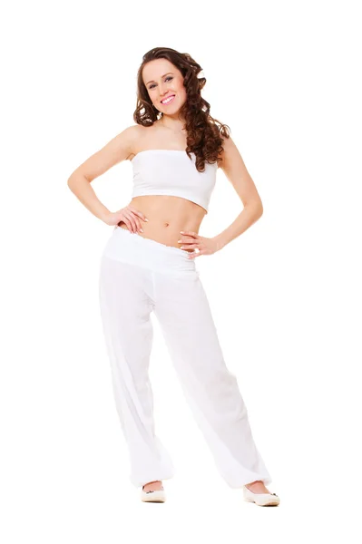 Beautiful young brunette in white clothes — Stock Photo, Image
