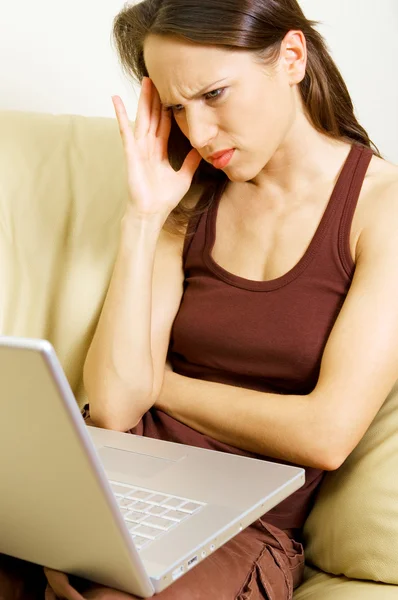 Fatigued woman with laptop — Stock Photo, Image