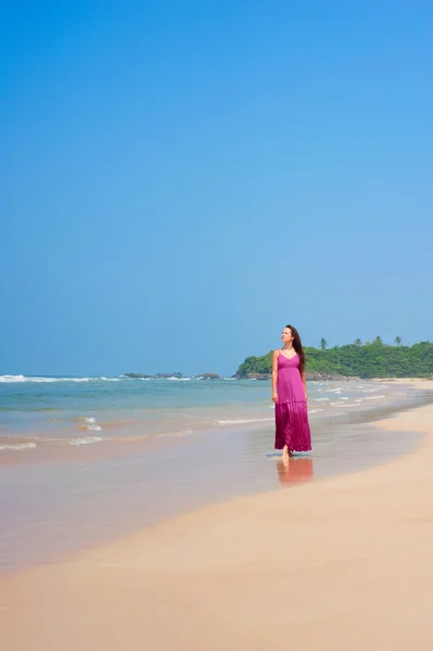 Pleasant woman walking at the beach — Stock Photo, Image