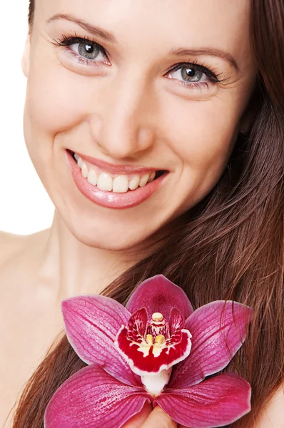 Portrait of smiley woman with flower — Stock Photo, Image