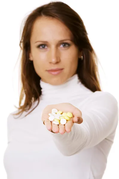 Pretty woman offering pills — Stock Photo, Image