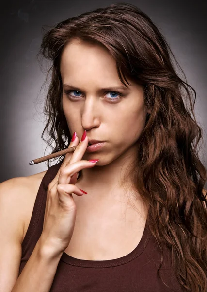 Serious woman with cigarette — Stock Photo, Image