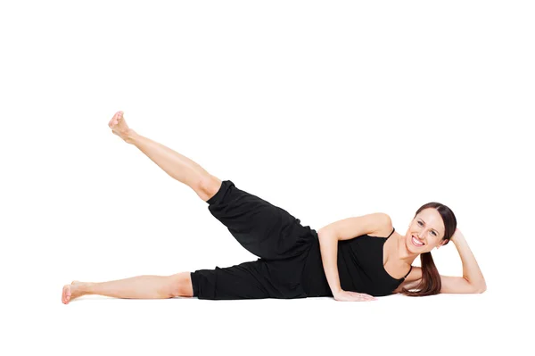 Mulher sorridente fazendo exercício — Fotografia de Stock