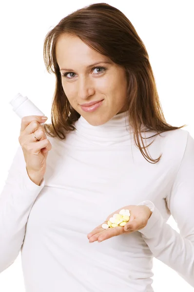 Donna sorridente in possesso di bottiglia e pillole — Foto Stock