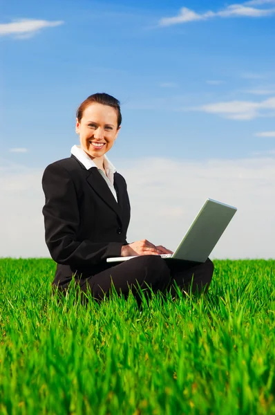 Smiley woman with computer — Stock Photo, Image