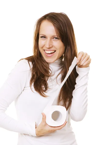 Mulher sorridente com rolo de papel higiênico — Fotografia de Stock