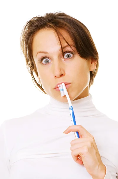 Удивлённая женщина с зубной щеткой — стоковое фото