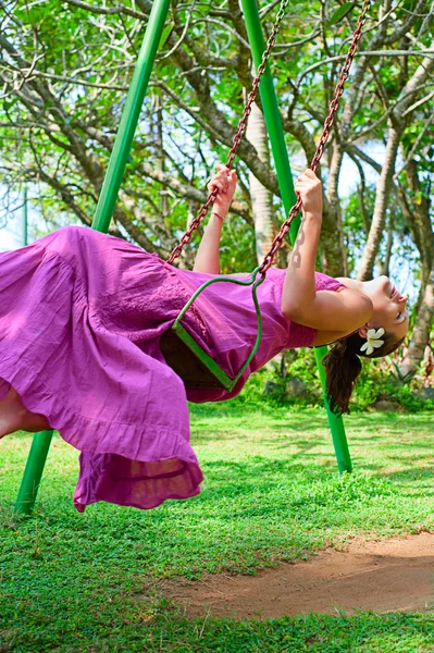 Swinging happy girl — Stock Photo, Image