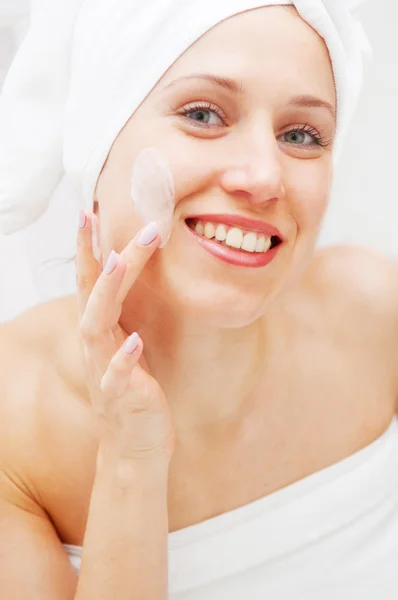 Woman with cream on her face — Stock Photo, Image